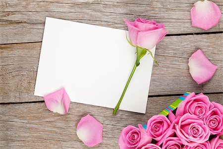 simsearch:400-08110734,k - Valentines day greeting card or photo frame and gift box full of pink roses over wooden table. Top view Stock Photo - Budget Royalty-Free & Subscription, Code: 400-08112099