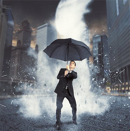 Businessman protected with umbrella from ice flow Stock Photo - Budget Royalty-Free & Subscription, Code: 400-08112136