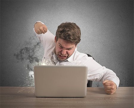 simsearch:400-09030070,k - Stressed businessman breaks the computer with punch Stock Photo - Budget Royalty-Free & Subscription, Code: 400-08112133