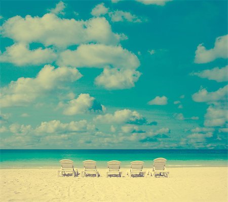 simsearch:400-07715201,k - Concept photo of beach with chair in vintage toned. Fotografie stock - Microstock e Abbonamento, Codice: 400-08112228