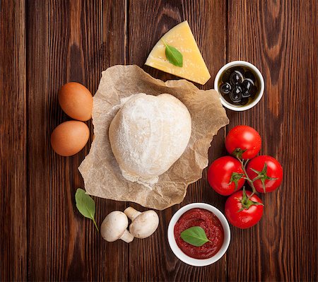 simsearch:400-05878972,k - Pizza cooking ingredients. Dough, vegetables and spices Stockbilder - Microstock & Abonnement, Bildnummer: 400-08112467