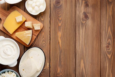 Dairy products on wooden table. Sour cream, milk, cheese, yogurt and butter. Top view with copy space Stock Photo - Budget Royalty-Free & Subscription, Code: 400-08112485