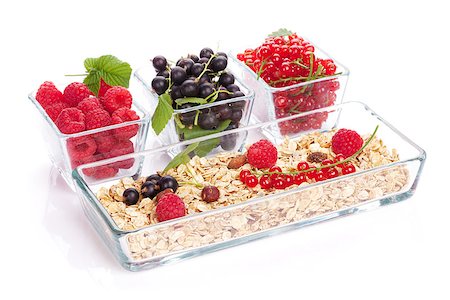 porridge and berries - Healthy breakfast with muesli and berries. Isolated on white background Stock Photo - Budget Royalty-Free & Subscription, Code: 400-08112492