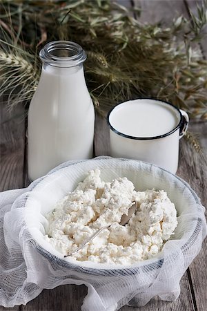 Milk, cottage cheese, wheat and oat grains on old wooden background. Concept of judaic holiday Shavuot. Stock Photo - Budget Royalty-Free & Subscription, Code: 400-08112749