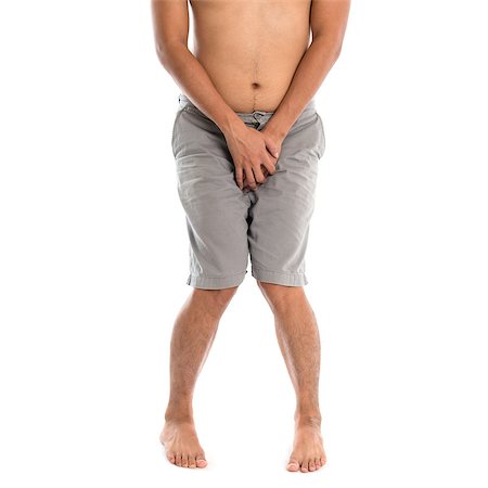 Asian man needing to urinate by covering his crotch with both hands, isolated on white background Foto de stock - Super Valor sin royalties y Suscripción, Código: 400-08112842