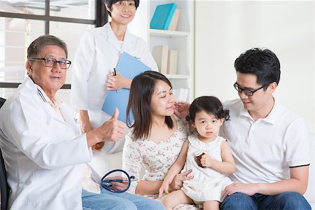 Pediatrician giving a thumb up after examined child. Pediatrician and patient healthcare concept. Stock Photo - Budget Royalty-Free & Subscription, Code: 400-08112864