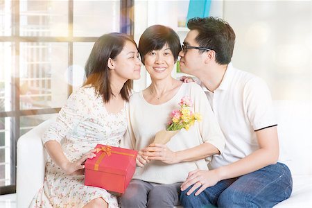 Happy mothers day. Asian boy and girl kissing mother. Family living lifestyle at home. Photographie de stock - Aubaine LD & Abonnement, Code: 400-08112873