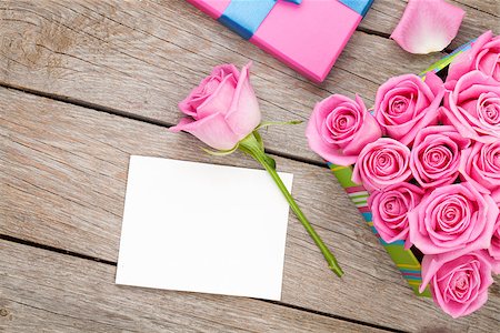 simsearch:400-08110734,k - Valentines day greeting card or photo frame and gift box full of pink roses over wooden table. Top view Stock Photo - Budget Royalty-Free & Subscription, Code: 400-08112943