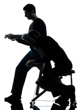 full body massage - two men performing chair back massage in silhouette studio on white background Stock Photo - Budget Royalty-Free & Subscription, Code: 400-08112979