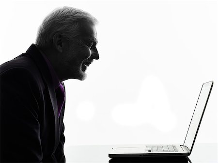 One Caucasian Senior Business Man computing laptop smiling Silhouette White Background Stock Photo - Budget Royalty-Free & Subscription, Code: 400-08113066
