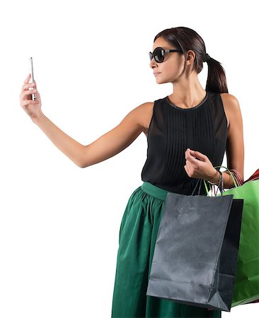 simsearch:400-07169053,k - Girl taking a photo with her purchases Stockbilder - Microstock & Abonnement, Bildnummer: 400-08113134