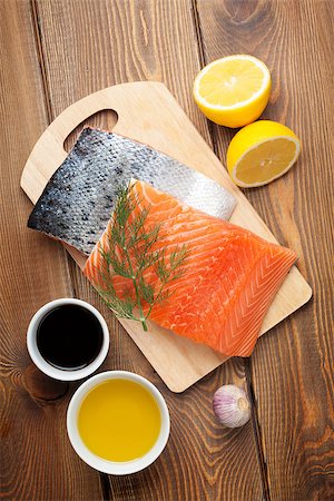 simsearch:400-08187570,k - Salmon, spices and condiments on wooden table. Top view Stockbilder - Microstock & Abonnement, Bildnummer: 400-08113640