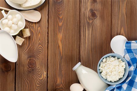 simsearch:400-07825089,k - Dairy products on wooden table. Sour cream, milk, cheese, eggs, yogurt and butter. Top view with copy space Stockbilder - Microstock & Abonnement, Bildnummer: 400-08113687