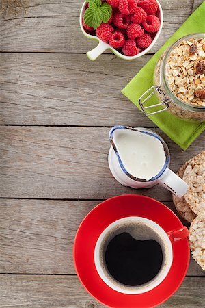 porridge and berries - Healthy breakfast with muesli, berries and milk. On wooden table with copy space Stock Photo - Budget Royalty-Free & Subscription, Code: 400-08113690