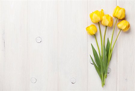 simsearch:400-08036453,k - Yellow tulips over wooden table background with copy space Stock Photo - Budget Royalty-Free & Subscription, Code: 400-08113719