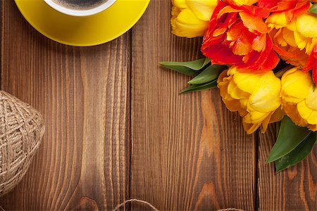 simsearch:400-08036453,k - Colorful tulips bouquet and coffee cup on wooden table. Top view with copy space Stock Photo - Budget Royalty-Free & Subscription, Code: 400-08113722