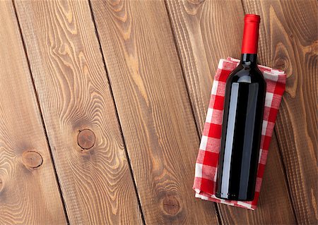 simsearch:400-07933837,k - Red wine bottle over towel on wooden table background. Top view with copy space Stockbilder - Microstock & Abonnement, Bildnummer: 400-08113745