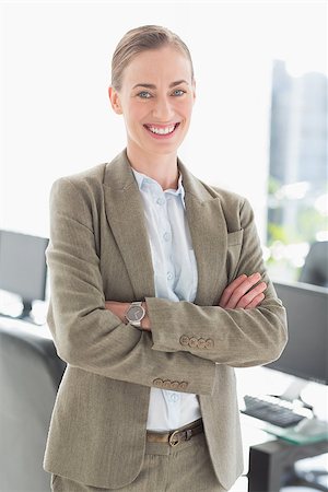 simsearch:400-07275828,k - portrait of beautiful businesswoman with arms crossed in office Photographie de stock - Aubaine LD & Abonnement, Code: 400-08135699