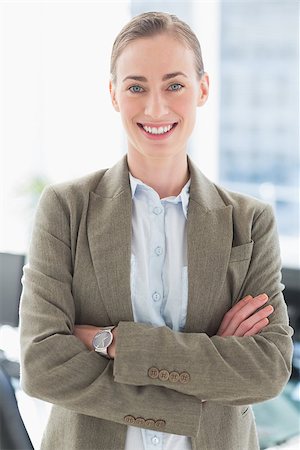 simsearch:400-07275828,k - Beautiful businesswoman with arms crossed in office Photographie de stock - Aubaine LD & Abonnement, Code: 400-08135700