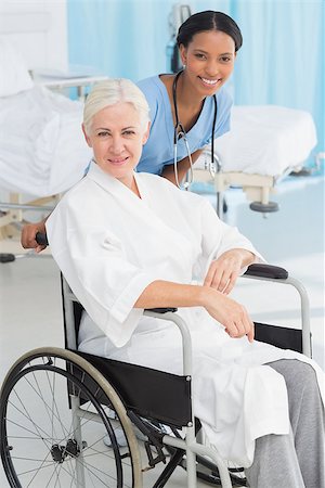 simsearch:6109-06195982,k - doctors and patient in wheelchair at the hospital Fotografie stock - Microstock e Abbonamento, Codice: 400-08136184