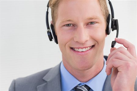 Handsome agent wearing headset in call center Stock Photo - Budget Royalty-Free & Subscription, Code: 400-08136327