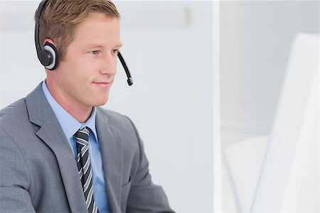 Handsome agent wearing headset in call center Stock Photo - Budget Royalty-Free & Subscription, Code: 400-08136328