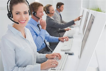 Business team working on computers and wearing headsets in call center Foto de stock - Super Valor sin royalties y Suscripción, Código: 400-08136386