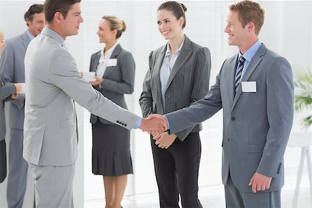 simsearch:400-08136478,k - Business people shaking hands in the meeting room Foto de stock - Super Valor sin royalties y Suscripción, Código: 400-08136429