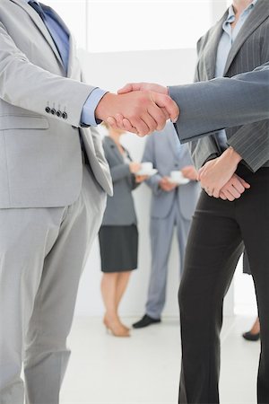 simsearch:400-08136433,k - Business people shaking hands in the meeting room Foto de stock - Super Valor sin royalties y Suscripción, Código: 400-08136432