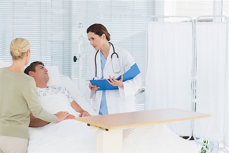 simsearch:400-07474040,k - Doctor checking her patient in hospital room Stock Photo - Budget Royalty-Free & Subscription, Code: 400-08136690