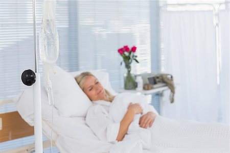 Happy patient lying on her bed in hospital Stock Photo - Budget Royalty-Free & Subscription, Code: 400-08136739