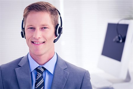 Handsome agent wearing headset in call center Stock Photo - Budget Royalty-Free & Subscription, Code: 400-08136800