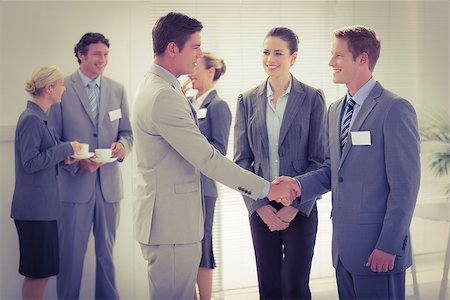 simsearch:400-08136433,k - Business people shaking hands in the meeting room Foto de stock - Super Valor sin royalties y Suscripción, Código: 400-08136814