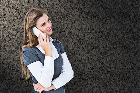 Happy blonde on the phone  against grey background Stock Photo - Budget Royalty-Free & Subscription, Code: 400-08137361