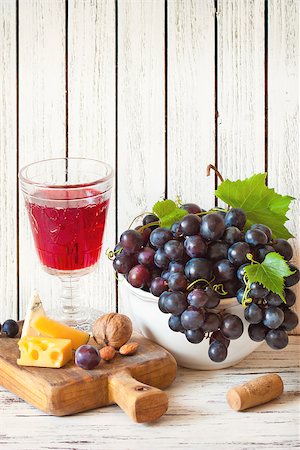 rose blue glass photos - Glass of red wine, fresh grape clusters, cheese and nuts for picnic. Vintage style. Stock Photo - Budget Royalty-Free & Subscription, Code: 400-08138367