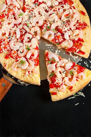 shrimp black - Fresh hot shrimp pizza on a pizzamaker shovel. Stock Photo - Budget Royalty-Free & Subscription, Code: 400-08138376