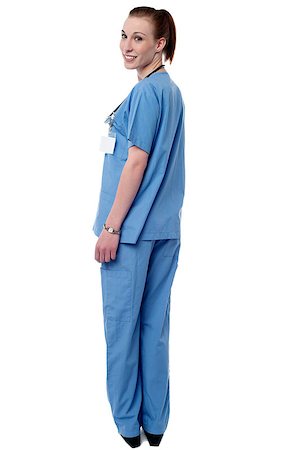simsearch:400-08131186,k - Smiling female doctor turning back and looking at you Stock Photo - Budget Royalty-Free & Subscription, Code: 400-08130636