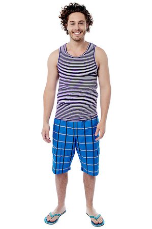 Smiling young man standing in swimwear Stock Photo - Budget Royalty-Free & Subscription, Code: 400-08130674