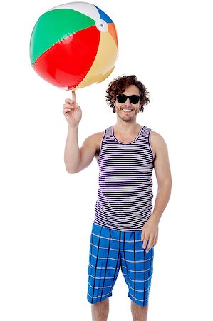 Young handsome guy playing with a beach ball Stock Photo - Budget Royalty-Free & Subscription, Code: 400-08130687