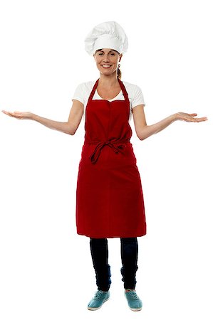 Smiling middle aged female chef with open arms Stock Photo - Budget Royalty-Free & Subscription, Code: 400-08130952
