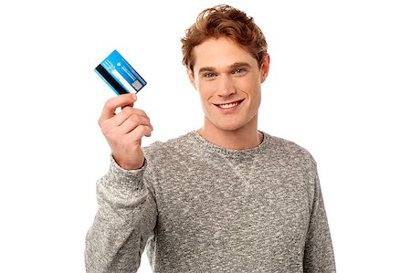simsearch:400-06795988,k - Handsome casual man holding his debit card Foto de stock - Super Valor sin royalties y Suscripción, Código: 400-08131032