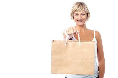 Middle aged woman carrying shopping bag Stock Photo - Budget Royalty-Free & Subscription, Code: 400-08131074