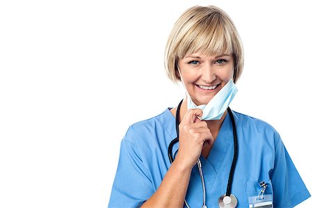 simsearch:400-08131186,k - Experienced lady doctor removing her surgical mask Stock Photo - Budget Royalty-Free & Subscription, Code: 400-08131083