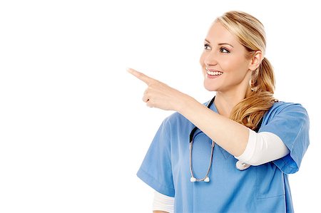 simsearch:400-08131186,k - Beautiful female physician showing at something Stock Photo - Budget Royalty-Free & Subscription, Code: 400-08131167