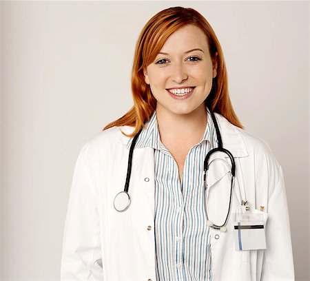 simsearch:400-08131186,k - Happy female doctor posing to the camera Stock Photo - Budget Royalty-Free & Subscription, Code: 400-08131163