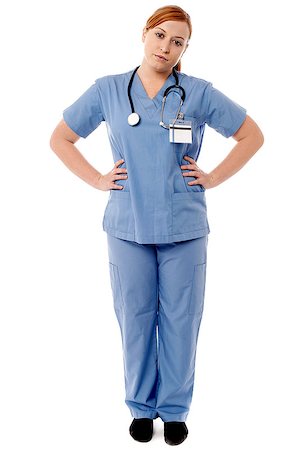 simsearch:400-08131186,k - Female nurse in uniform posing with hands on hip Foto de stock - Royalty-Free Super Valor e Assinatura, Número: 400-08131181