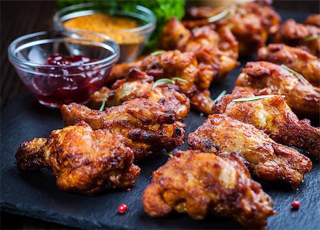 BBQ chicken wings with spices and dips Stock Photo - Budget Royalty-Free & Subscription, Code: 400-08131604