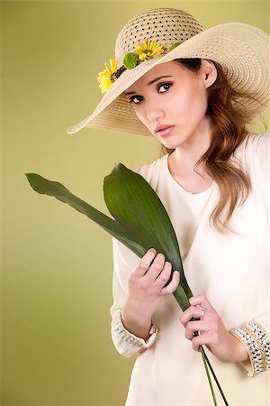simsearch:400-07986693,k - woman wearing hat with flowers on light green background Stock Photo - Budget Royalty-Free & Subscription, Code: 400-08131637