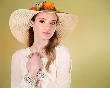 simsearch:400-07986693,k - woman wearing hat with flowers on light green background Stock Photo - Budget Royalty-Free & Subscription, Code: 400-08131632