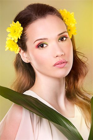 simsearch:400-07986693,k - cuacasian woman wearing yellow flowers on green background Stock Photo - Budget Royalty-Free & Subscription, Code: 400-08131698